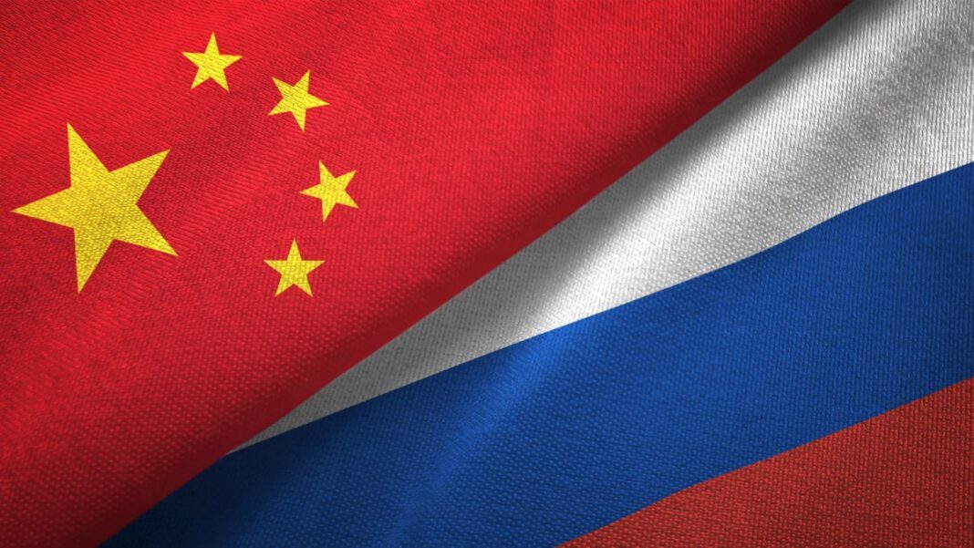 Putin & Xi Might Hash Out A Grand Deal That Would Enter Into Force If The Ukraine Talks Collapse Chinese and Russian Flags Montage