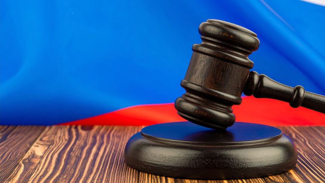 Can Putin Legally Stop The Conflict Without First Controlling All The Disputed Territory? Russian Flag Behind Judges Gavel