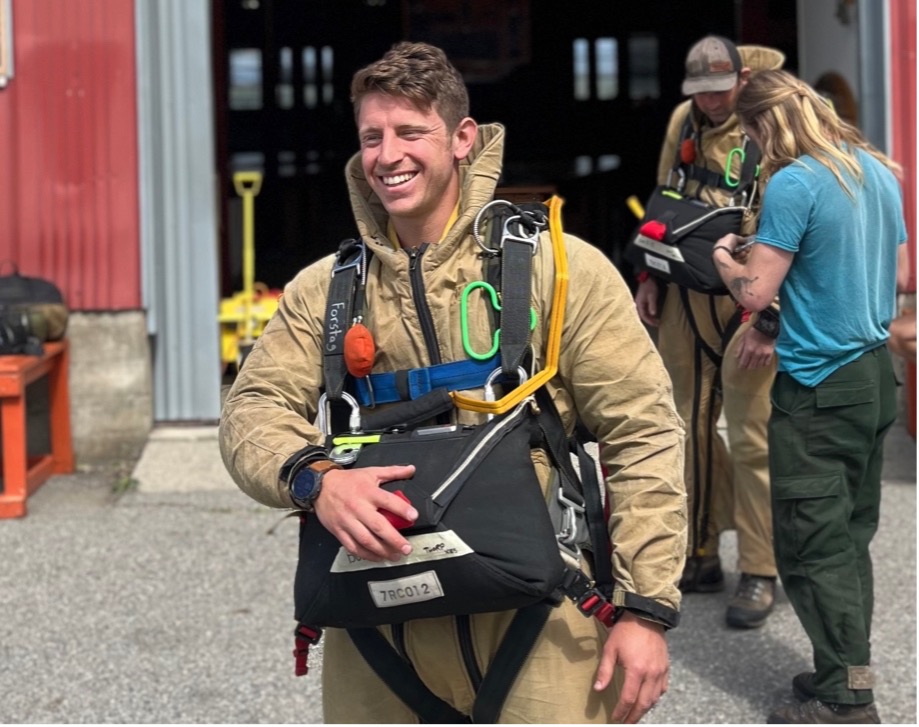 Sam Forstag in front of the North Cascades Smokejumper Base